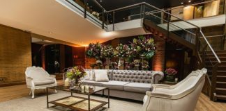 Tips to Design a Welcoming and Safe Reception Area for Your Business Safe reception area with comfortable seating and elegant floral arrangements.