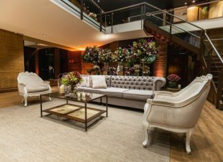 Tips to Design a Welcoming and Safe Reception Area for Your Business Safe reception area with comfortable seating and elegant floral arrangements.