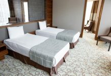 How to Transform Your Spare Room into a Cozy Guest Retreat A cozy guest retreat featuring two single beds in a beautifully decorated spare room.