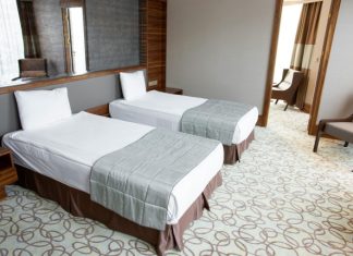 How to Transform Your Spare Room into a Cozy Guest Retreat A cozy guest retreat featuring two single beds in a beautifully decorated spare room.